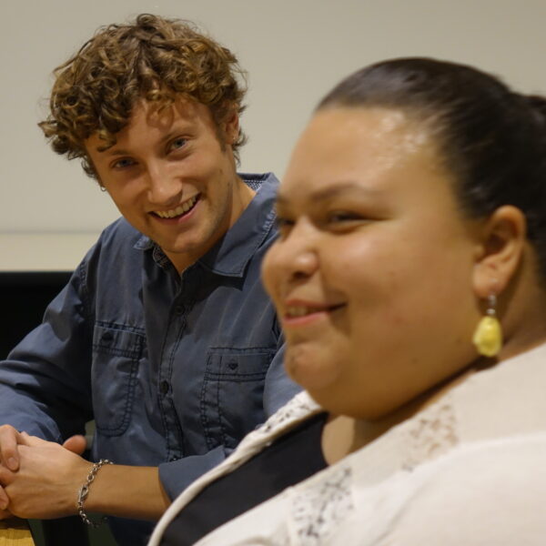 Two instructors sharing story in interview