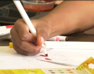 Student's hand drawing on paper